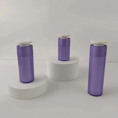 Botella de plástico púrpura para dispensadores de cosméticos con bomba de presión blanca