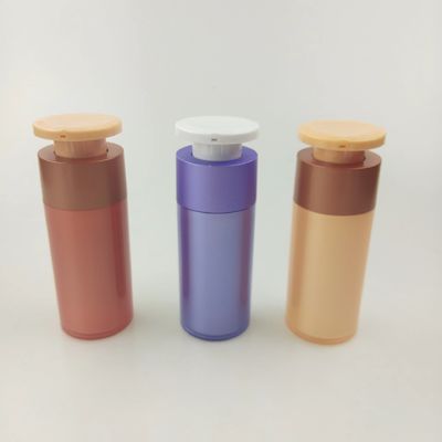 Botella de plástico púrpura para dispensadores de cosméticos con bomba de presión blanca