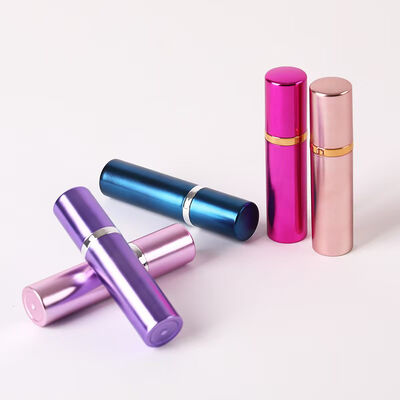 Botella pulverizadora de perfume portátil de aluminio rosa de lujo con anillo metálico