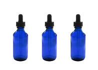 Botellas de aceite esencial vacías azules que almacenan las sustancias químicas de la química de los perfumes