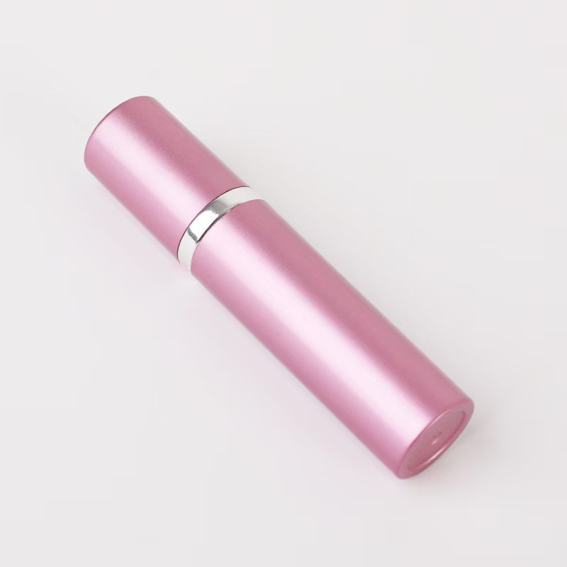 Botella pulverizadora de perfume portátil de aluminio rosa de lujo con anillo metálico